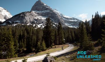 Ebiker riding a gravel road in mountains