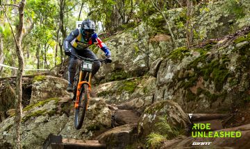 Mountain biker attacks steep drop